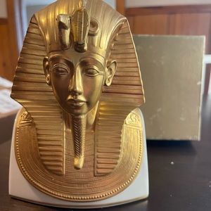 The Gold Mask of Tutankhamun. The snake has been chipped off his head piece.